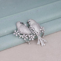 Silver bird-shaped brooch with gemstones on a light blue and beige background, Round & Marquise CZ Stone Love Bird Brooch – Sparkling Bird Jewelry Pin