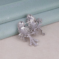 Silver filigree brooch on a light blue and beige background, Love Bird Brooch with Round & Marquise CZ Stones – Elegant Animal Pin