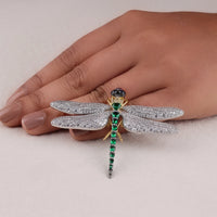 Jewelry dragonfly brooch with gemstones on a hand against a neutral background, Emerald Ruby Sapphire CZ Dragonfly Jewelry Brooch – Statement Gemstone Pin