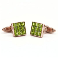 metalcolor:rose Pair of peridot gemstone cufflinks on a white background