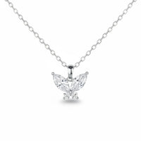 Diamond butterfly pendant on a chain against a white background