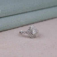 Diamond ring on a soft surface with a neutral background, Classic Oval Cut Promise Ring With Baguette Stones, Stunning Vintage Style Bridal Jewelry