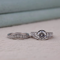 Two diamond rings on a soft surface with a blurred background