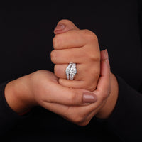 Close-up of a hand wearing a diamond ring against a black background, Vintage Style Moissanite Engagement Ring Set, Round Solitaire with Curved Band