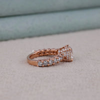 Rose gold ring with diamonds on a neutral background