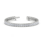 Silver bracelet with diamond accents on a white background