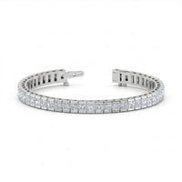 Silver bracelet with diamond accents on a white background