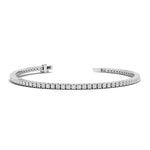 Silver bracelet with clear stones on a white background