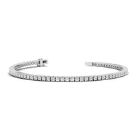 Silver bracelet with clear stones on a white background