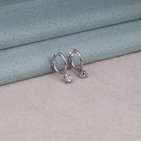 Silver hoop earrings with moissanite, dainty everyday earrings
oval cut moissanite
minimal hoop earrings