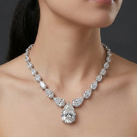 Diamond necklace on a model against a dark background