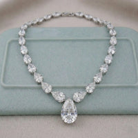 Diamond necklace on a light blue cushion