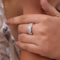 Close-up of a hand wearing a diamond ring with a blurred background, diamond eternity band, unique wedding ring, dainty wedding band, promise ring, engagement ring band, moissanite ring, 