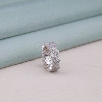 Silver ring with multiple gemstones on a light background, moissanite eternity band, baguette cut moissanite ring, round moissanite ring, wedding band, eternity wedding ring, diamond alternative band,