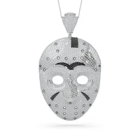 Mask-shaped pendant with black accents on a white background