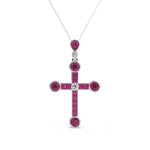 Cross-shaped pendant with red gemstones and a diamond on a white background ,Vintage Inspire Circa 1905 Belle Epoque Ruby Cross Pendant