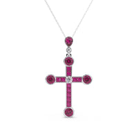 Cross-shaped pendant with red gemstones and a diamond on a white background ,Vintage Inspire Circa 1905 Belle Epoque Ruby Cross Pendant