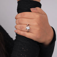 Hand wearing a diamond ring with a plain background, Floating Moissanite Ring, Minimalist Moissanite Engagement Ring, Contemporary Design Moissanite Ring