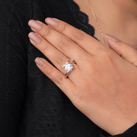 Hand wearing a diamond ring with a black background, Princess Cut Solitaire Ring, Non-Traditional Engagement Ring, Sleek Moissanite Ring, Tension Mount Moissanite Jewelry