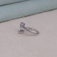 Silver ring with a clear gemstone on a beige surface,  Floating Stone Engagement Ring, Chic Moissanite Jewelry, Luxury Moissanite Ring for Her, Minimal Engagement Ring