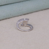 Silver ring with a unique design on a light gray surface, Princess Stone Engagement Band, Innovative Design Engagement Ring, Bypass Tension Solitaire