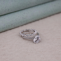 Silver ring with a large diamond on a beige surface, Moissanite Wedding And Engagement Jewelry, Sustainable Conflict Free Moissanite Bridal Set