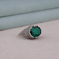 Silver ring with a green gemstone on a light background, Art Deco Cocktail Ring For Women, Infinity Shank Green Oval CZ Statement Ring, Bold Vintage Style Green CZ Anniversary Jewelry