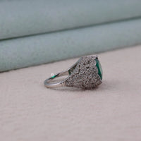 Silver ring with green gemstone on a light background, Filigree Antique Emerald CZ Ring, Oval Green Stone Vintage Engagement Cocktail Jewelry