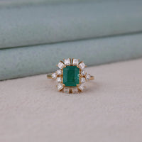 Gold ring with a green gemstone and diamond accents on a light background, 14K Yellow Gold Green Emerald Cut CZ Wedding Ring – Timeless Engagement Jewelry