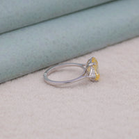 Silver ring with a yellow gemstone on a textured surface, yellow CZ radiant cut ring, three stone gemstone ring, triangle CZ stone ring, past present future ring, yellow gemstone engagement ring, CZ three stone ring, radiant cut CZ ring, CZ anniversary ring, white triangle CZ accents