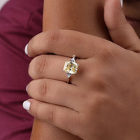 Close-up of a hand wearing a diamond ring with a yellow gemstone, Three Stone CZ Engagement Ring