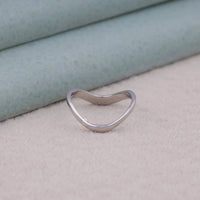 Silver ring with a unique design on a textured surface, Sterling Silver Enhancer Ring, Elegant Ring Guard Band