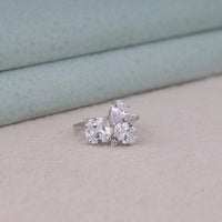 Silver ring with three clear gemstones on a light background, Five Stone Multi Cut Moissanite Ring – Oval, Pear, Cushion & Round Wedding Band