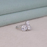 Silver ring with three clear gemstones on a light background, Moissanite Five Stone Ring – Oval, Pear, Cushion & Round Shape Engagement Band