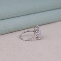 Silver ring with two rectangular gemstones on a light background, Anniversary Five Stone Moissanite Ring – Mixed Shape (Oval, Pear, Cushion, Round) Design