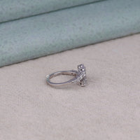 Silver ring with gemstones on a soft fabric background, Dainty Moissanite Ring, Unique Spiral Engagement Ring