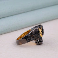 Silver ring with gold accents on a light blue and white background,silver bull ring, rock style ring, punk skull ring, motorcycle jewelry, antique silver ring, moissanite black skull ring, animal totem jewelry, horned skull ring, cow skull ring, alternative fashion ring, silver and gold ring