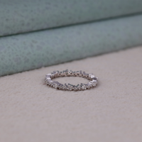 Silver ring with diamonds on a textured surface, Elegant Eternity Band For Bride, Affordable Moissanite Eternity Wedding Band, Moissanite Half Eternity Band