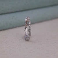 Silver ring with small diamonds on a light gray surface, Conflict Free Moissanite Ring, Everyday Wear Moissanite Ring, Moissanite Anniversary Band Ring