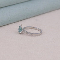 Silver ring with a green gemstone on a light background, Bold Green and Aqua Moissanite Ring, Unique Engagement Ring For Women,