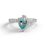 Ring with a heart-shaped blue gemstone on a white background, Green & Aqua Pear Cut Moissanite Half Halo Engagement & Wedding Ring, Two Stone Moissanite Toi Et Moi Ring,