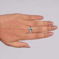 Hand wearing a ring with a blue gemstone on a gray background, Vibrant Green Moissanite Wedding Ring, Modern Toi Et Moi Engagement Ring, Sparkling Half Halo Bridal Ring