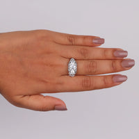 Hand wearing a diamond ring on a plain background, Sustainable Moissanite Vintage Wedding Ring, Conflict Free Three Stone Bridal Ring, Affordable Art Deco Engagement Jewelry