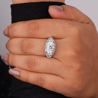 Close-up of a hand wearing a diamond ring on a neutral background, Three Stone Moissanite Anniversary Ring, Classic Art Deco Bridal Jewelry, 14K Gold Three Stone Moissanite Ring