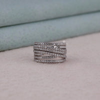 Silver ring with multiple bands on a light gray surface, Multi Layer Moissanite Band Ring, Round Cut Moissanite Wedding Ring