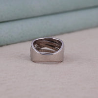 Silver ring with engraved design on a light gray surface, Crossover Round Moissanite Ring, Multi Band Wedding or Anniversary Ring