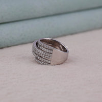 Silver ring with diamond accents on a light gray surface, Round Cut Moissanite Criss Cross Ring, Multi Row Statement Wedding Band