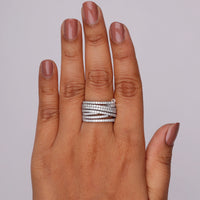 Hand wearing a silver ring on a plain background, Round Moissanite Criss Cross Multi Layer Wedding Band Ring, Modern Criss Cross Moissanite Bridal Jewelry