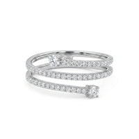 Silver ring with diamond accents on a white background