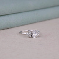 Silver ring with a diamond on a light background, Oval & Marquise & Round Moissanite Leaf Inspired Engagement Ring, Nature Inspired Moissanite Bridal Jewelry